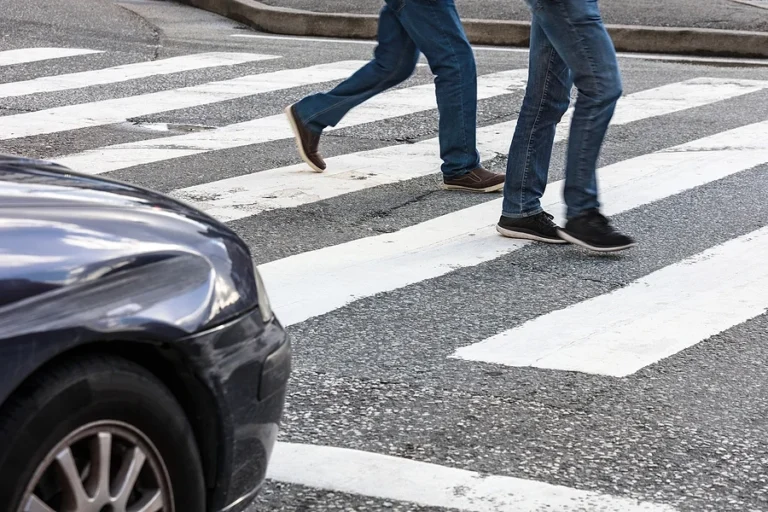 pedestrian crossing and car at the crossroads