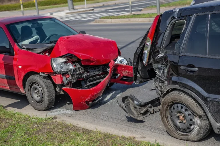 car crash accident on street, damaged automobiles after collision in city, two cars in city street