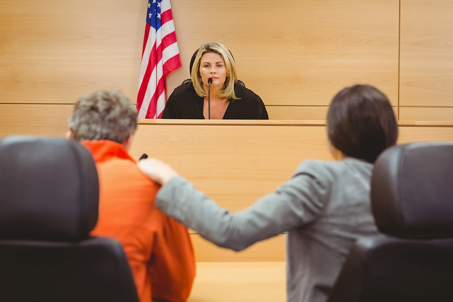 north dakota criminal defense attorney supporting client in a courtroom as the judge issues his sentence