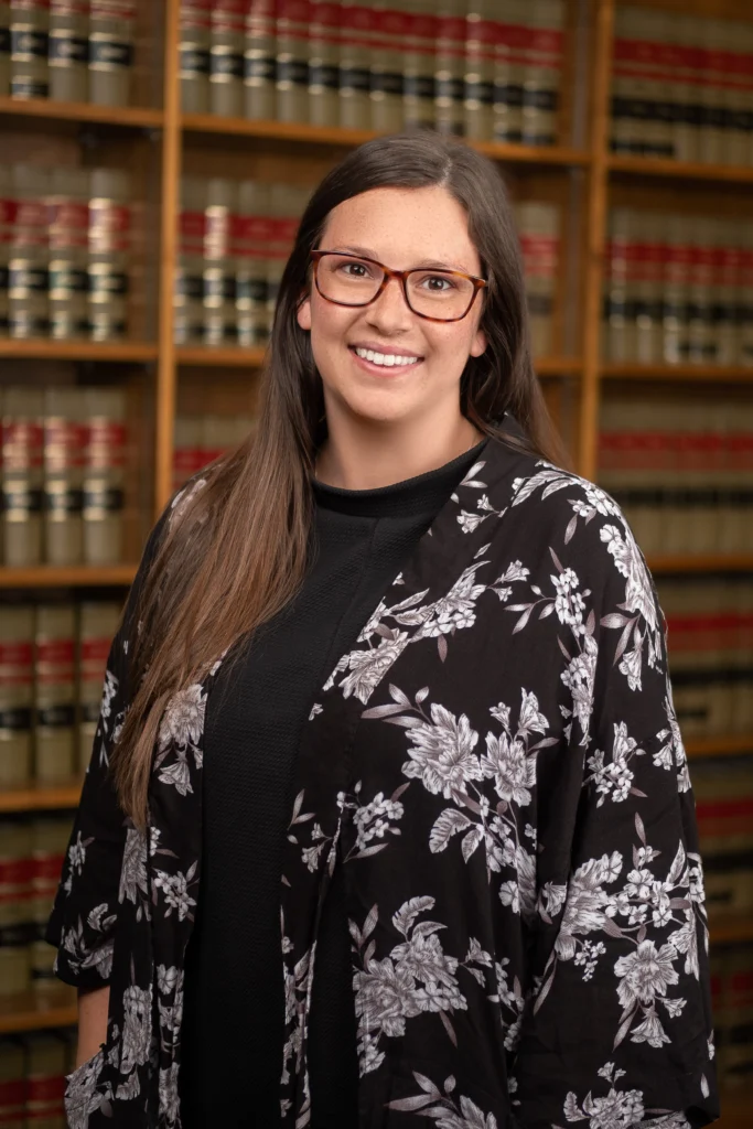 Zoa Chapman, the Senior Paralegal for Sand Law poses for a headshot